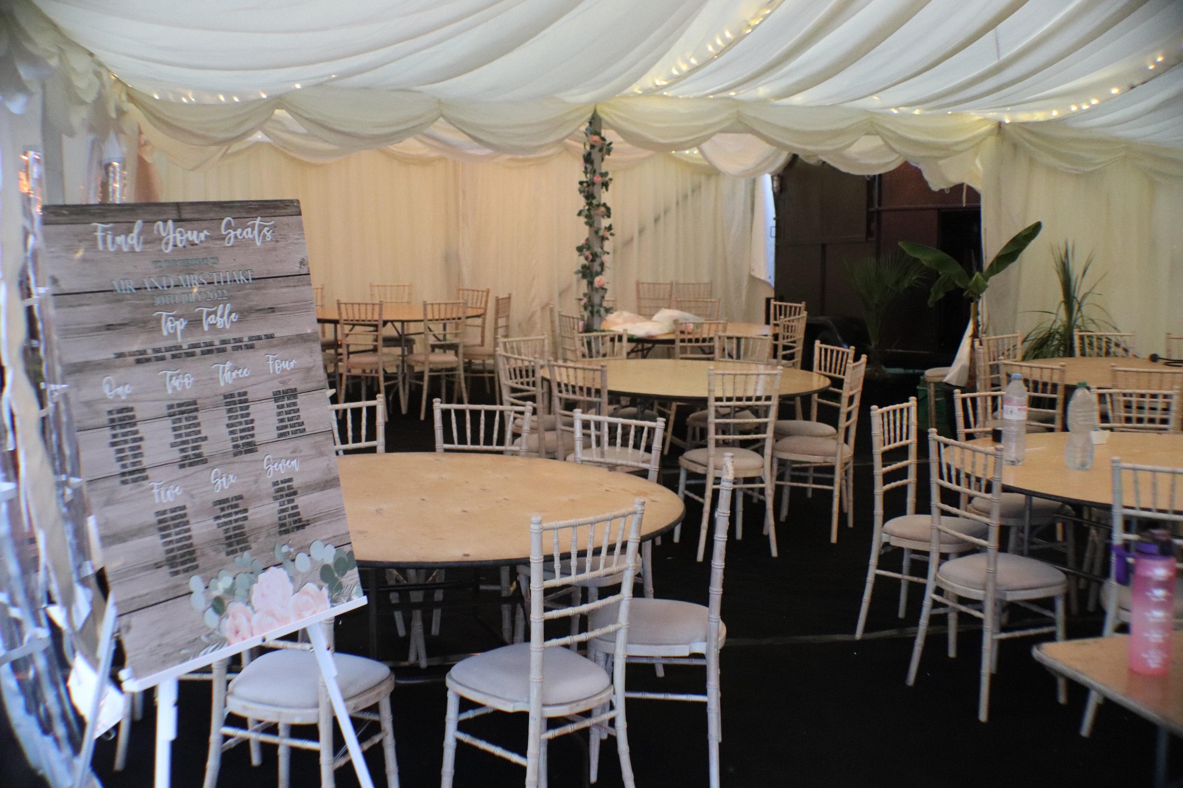 Marquee wedding reception with round tables