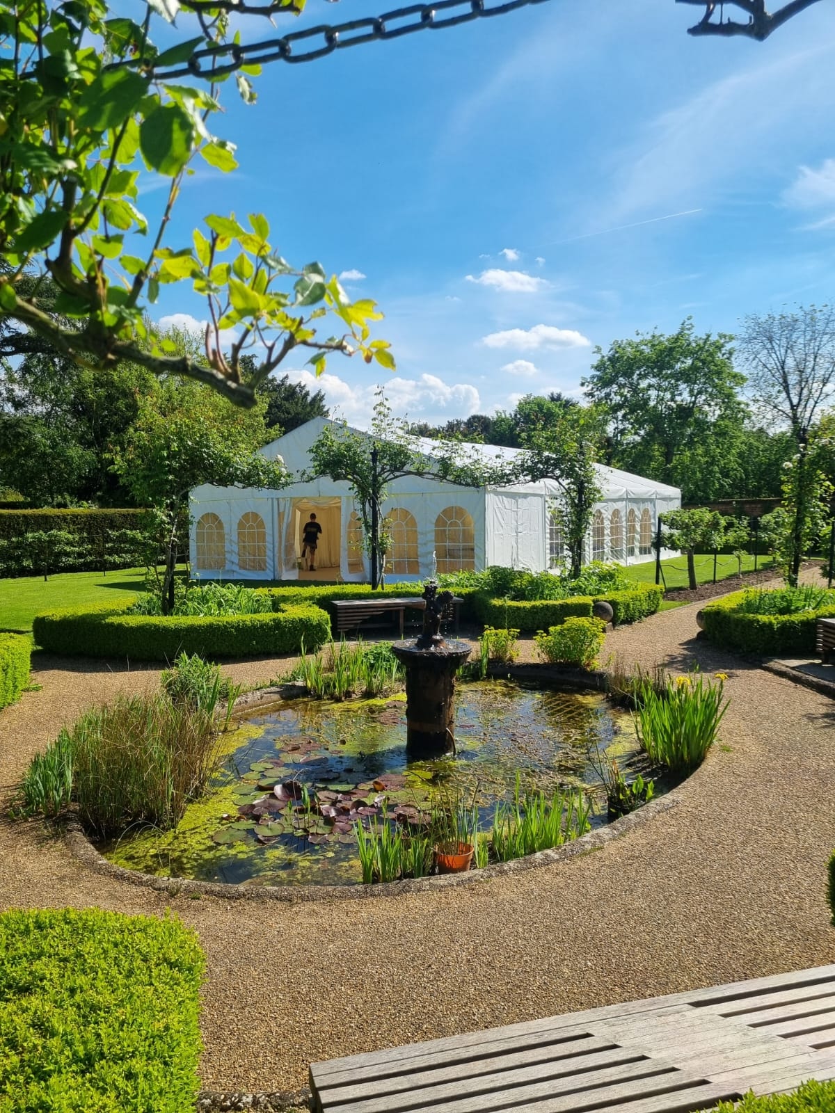Saffron Marquees clear span marquee in a garden setting