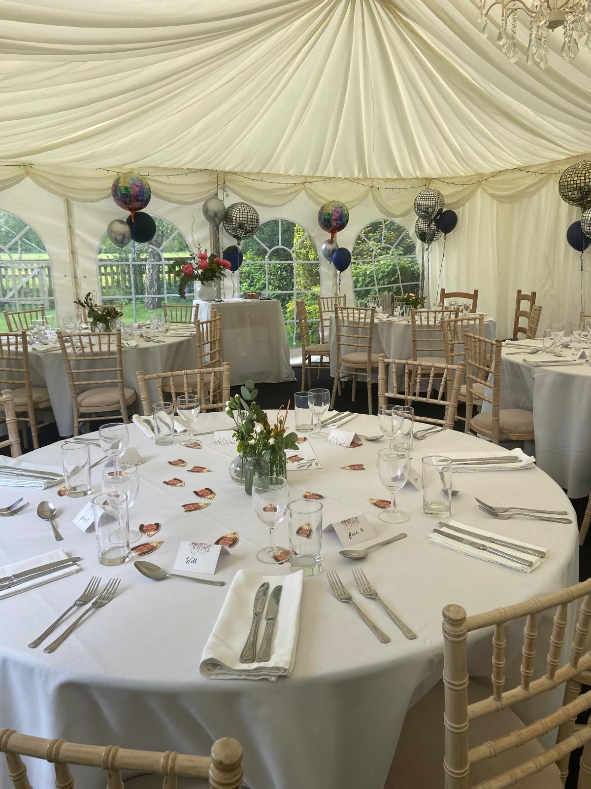 Marquee interior decorated with balloons for a celebration