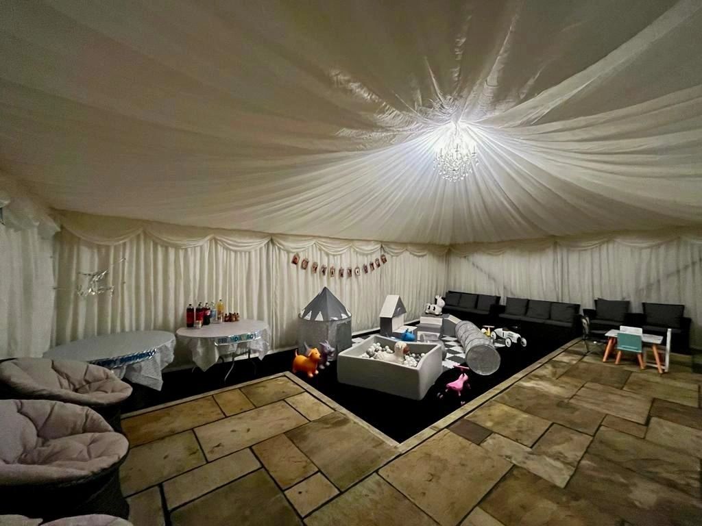 Marquee interior with decorative draping and lighting